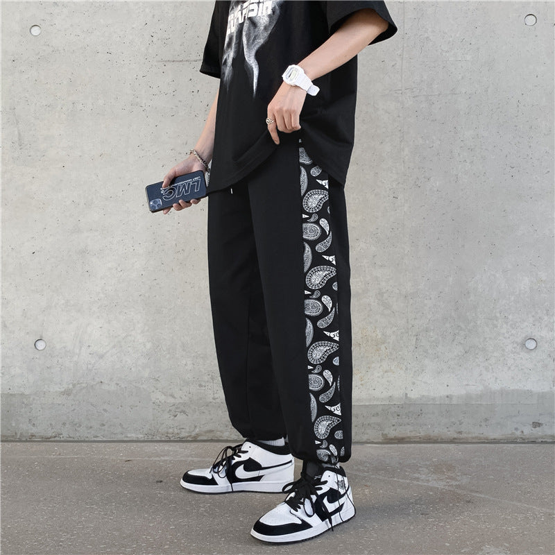 Koreanische Version des Trends der Retro Cashew Flower Casual Pants Stitching Loose Drawstring Pants