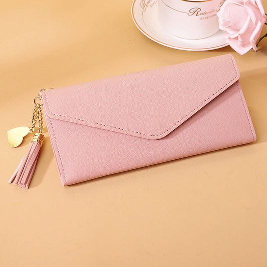 Handtasche mit Quastenanhänger
