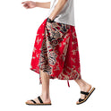 Locker sitzende Herrenhose im chinesischen Stil mit Elefantenblume, verkürzte große Badehose, Rettich-Strandblumenhose