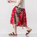 Locker sitzende Herrenhose im chinesischen Stil mit Elefantenblume, verkürzte große Badehose, Rettich-Strandblumenhose