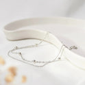 Stilvolles und schlichtes Fußkettchen für Damen mit leichter Luxus-Kupferperle und Doppelschicht-Ornament
