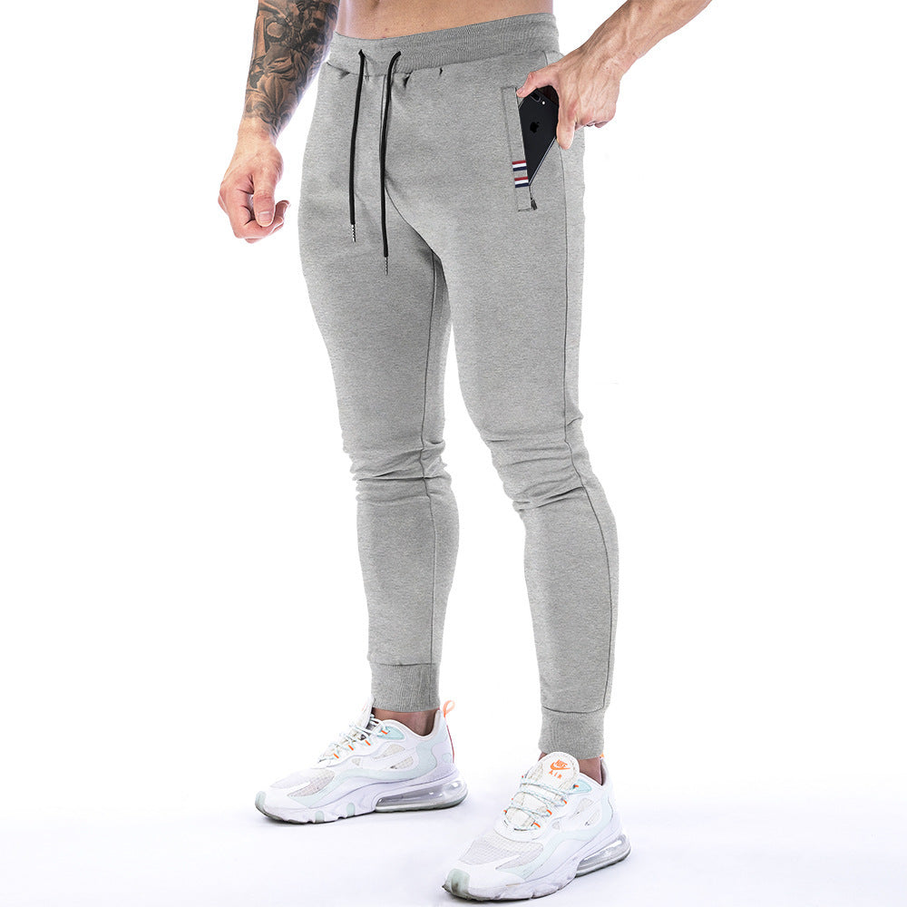 Einfarbige Sporthose mit Reißverschlusstasche