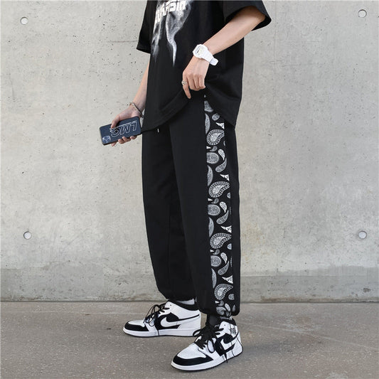 Koreanische Version des Trends der Retro Cashew Flower Casual Pants Stitching Loose Drawstring Pants